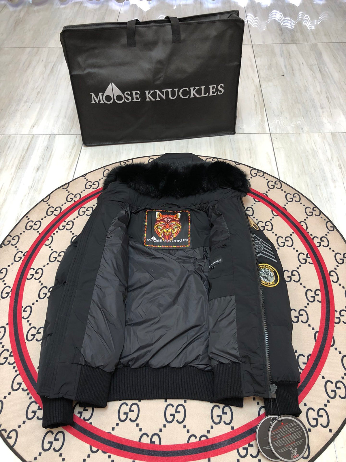 Moose Knuckles Unisex Multi-Patch Hooded Bomber Jacket | Black